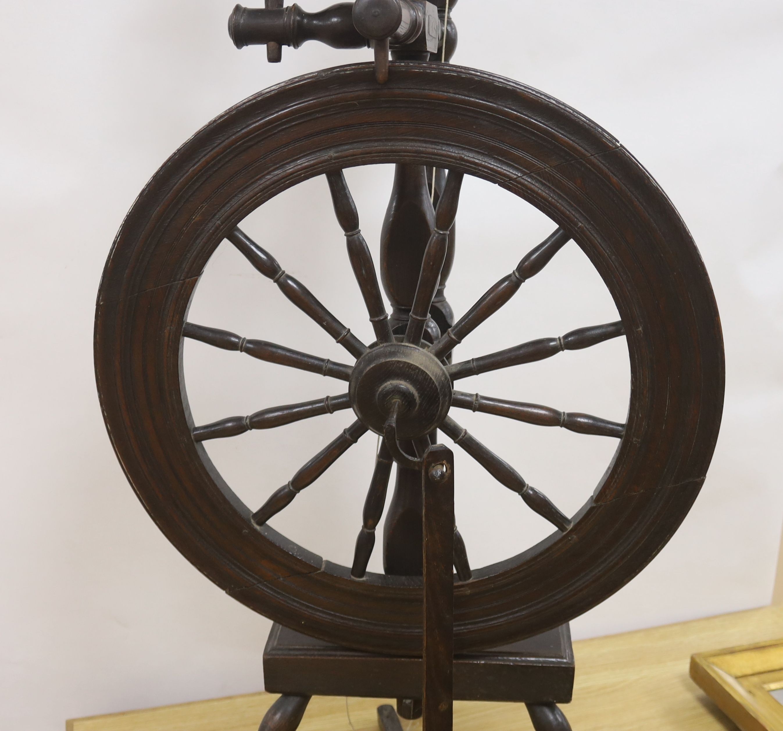 A 19th century beech and ash spinning wheel, 109 cm high